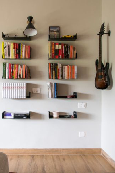 Personalising the home with you most loved books and instruments hanging on the wall
