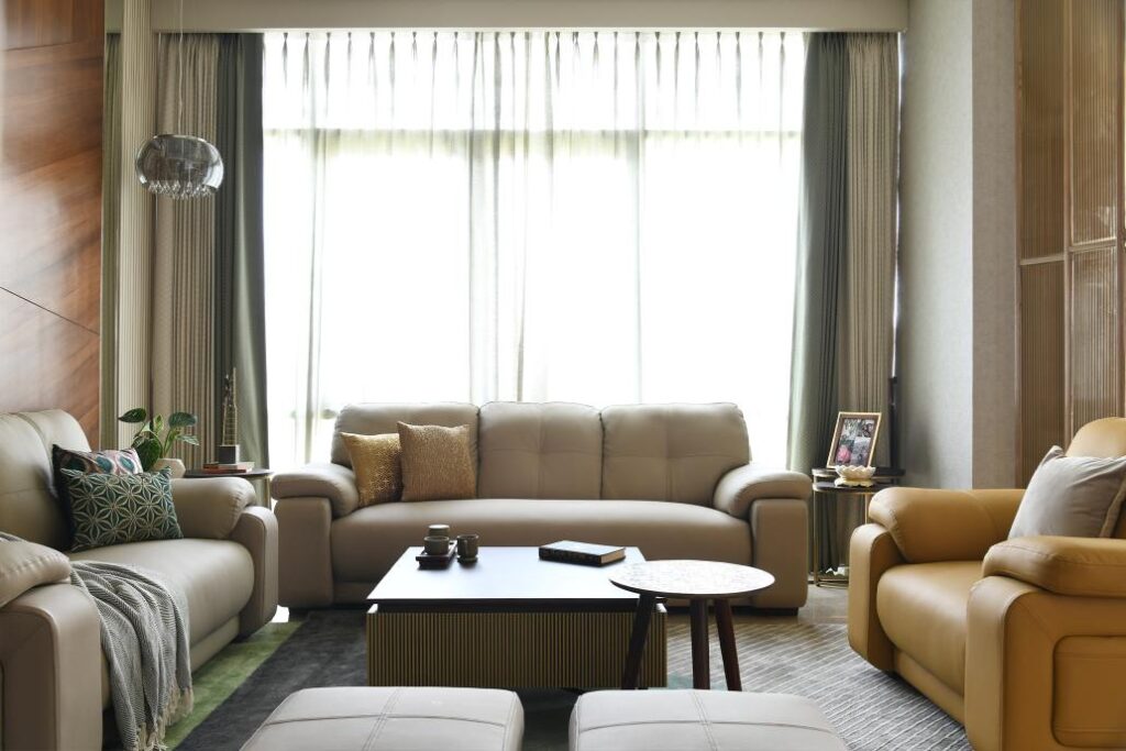 Contemporary Living Room Interiors with Plush Greige Sofa and Vibrant Rug