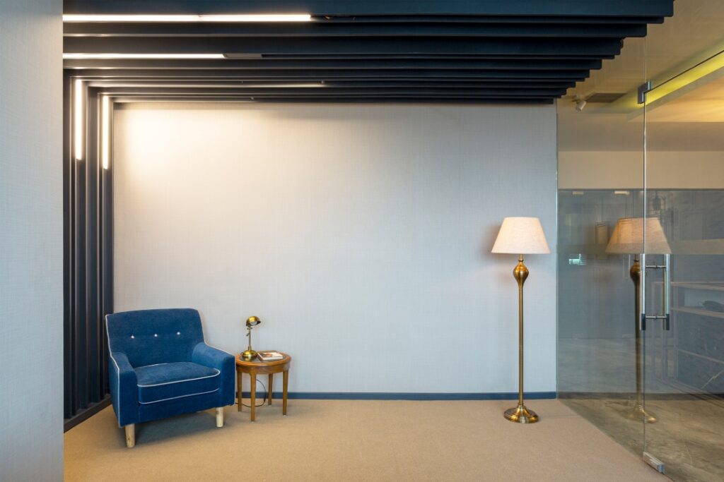 Metallic Office Interors with Sleek Lightings and Blue Sofa