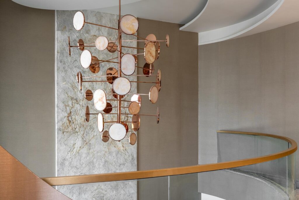 Curved Ceiling Design complemented by Marble Wall and Copper Metal Chandelier, Gatsby