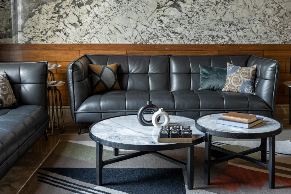 Dark Grey Sofas with Wooden and Marble Covering and a Geometric Patterend Rug, Gatsby