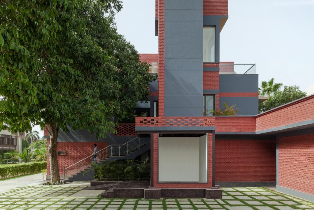 Dusty Red and Grey Color Facade Design Chambers, The Mann School