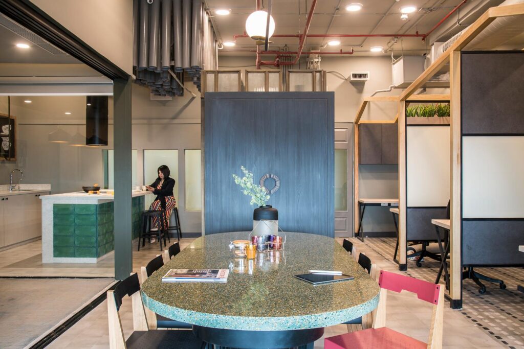 Modern Office Interiors with Green and Blue Accents and a Granite Table