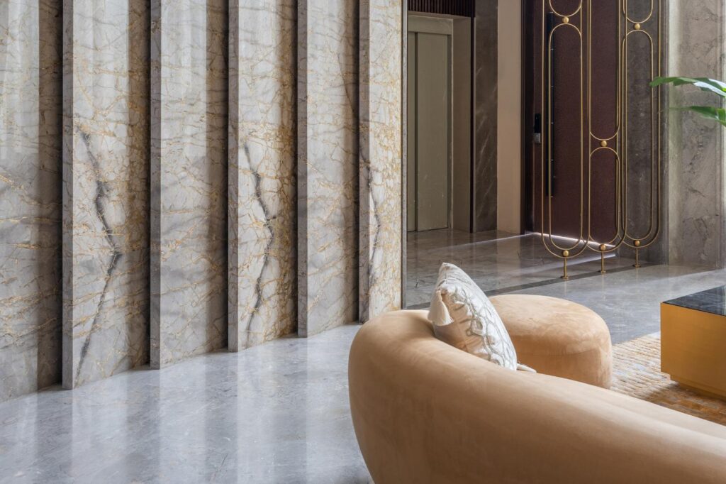 Plush Art Deco Interiors with Angled Marble Wall Design, Gatsby