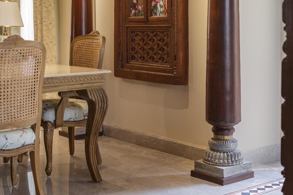 Traditional South Indian Dining Area with Intricately Carved Wooden Windows and Pillars, Marbella
